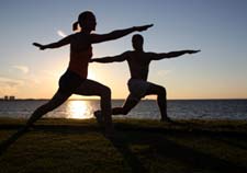 photo of couple doing yoga