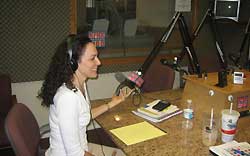 photo of Ginny on the air at the radio station