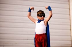 photo of boy in super hero outfit