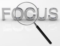 graphic of word 'focus' under magnifying glass