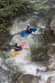 photo of kayakers in rapids