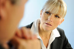 photo of women and man having serious conversation